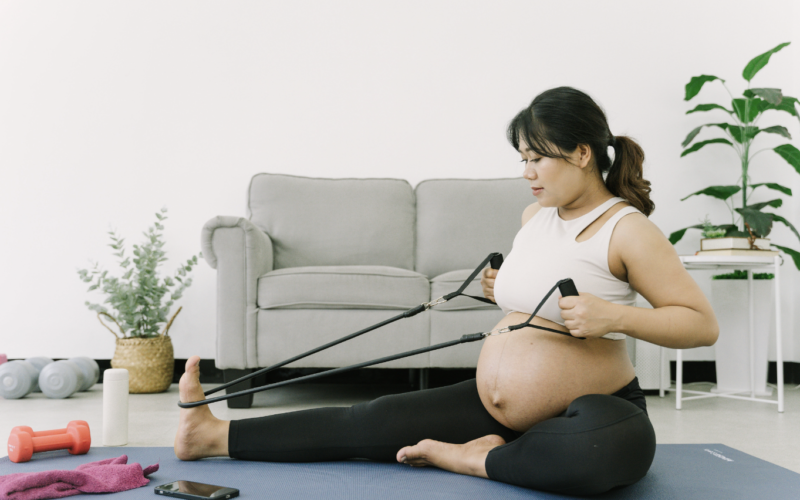 pregnant woman exercising. Exercising during pregnancy has many benefits.