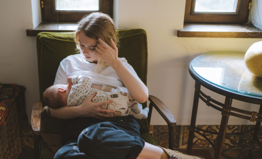 A mother struggling with breastfeeding