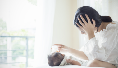 A mother with postpartum depression and anxiety with her baby